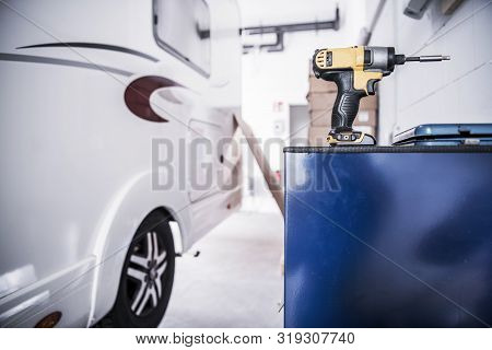 Camper Van Rv Repair Concept. Recreational Vehicle In The Service Center. Drill Driver Power Tool.
