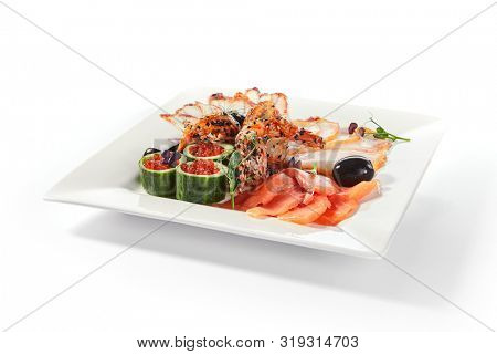 Fish platter with pink salmon, grilled eel, oil fish balyk and red caviar on elegant restaurant plate isolated on white background. Exquisite serving thin slices of salted and dried delicious seafood