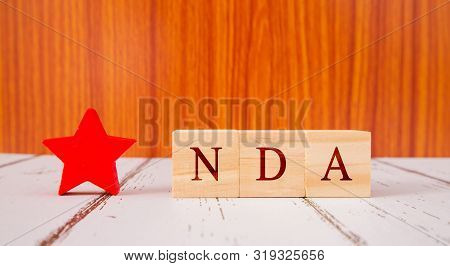 Concept Of Nda Exam Conducted In India For Recruitment On Wooden Block Letters.
