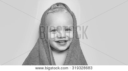 Adorable Baby Under A Hooded Towel After Bath. Bubble Bath Time. Happy Bath Time