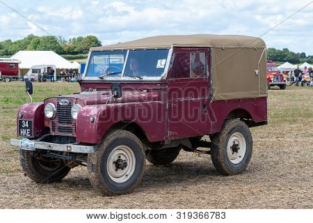 Haselbury Plucknett.somerset.united Kingdom.august 18th 2019.a Vintage Land Rover Is Being Driven At