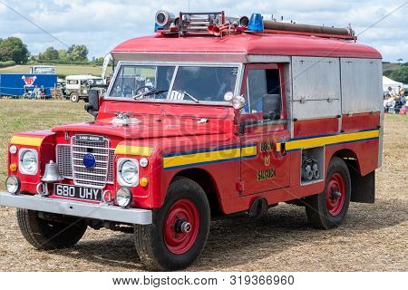 Haselbury Plucknett.somerset.united Kingdom.august 18th 2019.a Vintage Land Rover Is Being Driven At