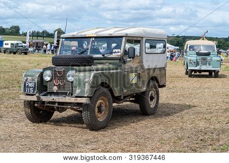 Haselbury Plucknett.somerset.united Kingdom.august 18th 2019.a Vintage Land Rover Is Being Driven At