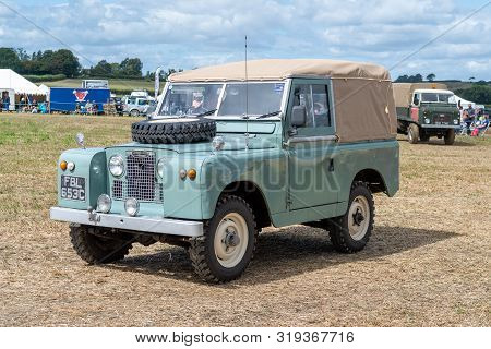 Haselbury Plucknett.somerset.united Kingdom.august 18th 2019.a Vintage Land Rover Is Being Driven At