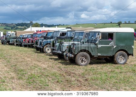 Haselbury Plucknett.somerset.united Kingdom.august 18th 2019.a Row Of Vintage Land Rovers Are Parked