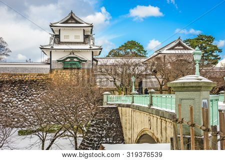 Kanazawa, Japan at the castle in winter with snow.