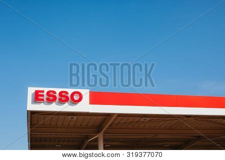 Lyon, France - February 26, 2019: Esso Logo On Its Gas Service Station In Lyon, France On Blue Sky B