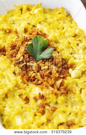 Homemade Swabian Pasta Dish With Parsley On Wood