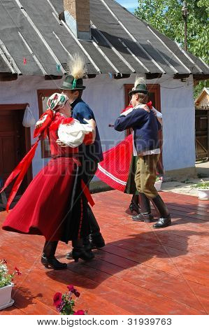 Young dancers in traditional clothe participate at a wedding