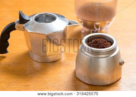Moka Pot And Coffee Beans And Grinder.