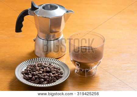 Moka Pot And Coffee Beans And Grinder.