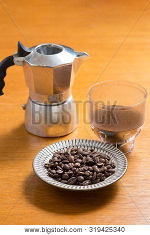 Moka Pot And Coffee Beans And Grinder.