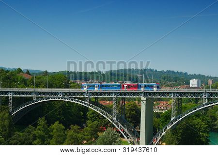 A Tram Runs Over The Bridge 'kirchenfeldbrucke' In Bern, Switzerland On A Summerday In 2019