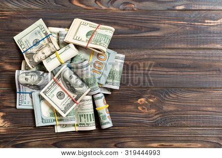 Us Dollar Bills Bundles Stack. One Hundred Dollar Bills With Stack Of Money In The Middle. Top View 