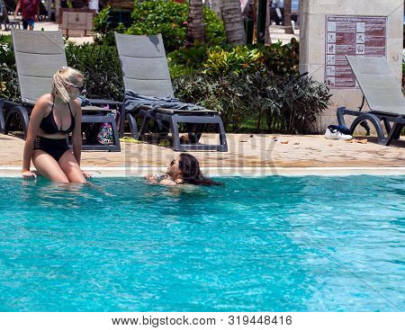 Dominican Republic, Bayaibe, Catalonia Gran Dominicus Hotel - 09 June 2019: Young Women Swimming In 