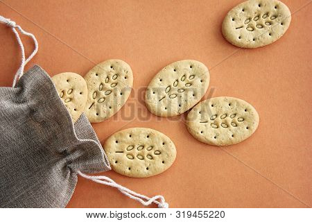 Reusable Canvas Bag And Multicereal Biscuits On Brown Background . Care For The Environment And Heal