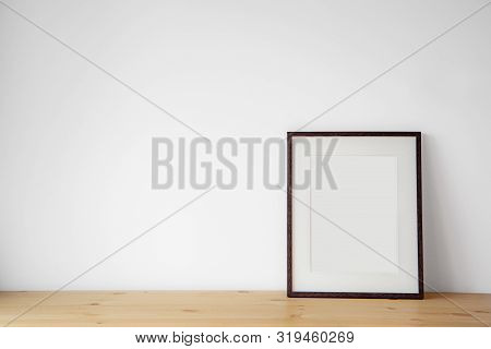 Blank Black Picture Frame On The White Wall And The Wooden Floor, Template Poster Interior Photo 3d 