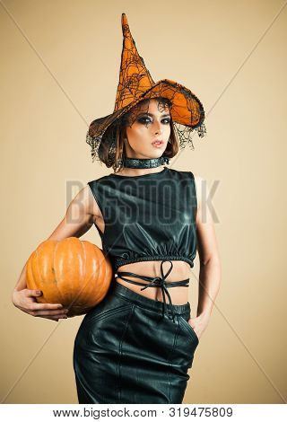 Witch In Magic Hat. Beautiful Young Surprised Woman In Witch Hat Costume. Beautiful Young Surprised 