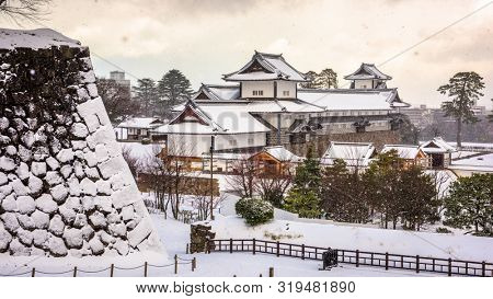 Kanazawa, Japan at the castle in winter with snow.
