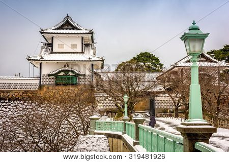 Kanazawa, Japan at the castle in winter with snow.