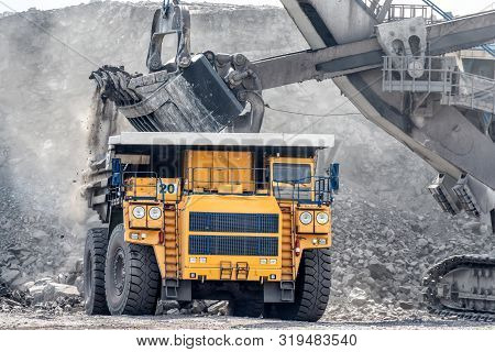 Open Mountain Quarry. Loading Coal Into A Mining Truck. Shipment Of Mountain Masyy From The Face. Mi