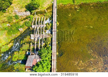 Tonkovic Vrilo, River Source Of Gacka And Wooden Bridge Over The River, Aerial View, Lika Region Of 