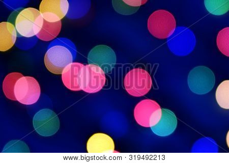 Blue Christmas Bokeh With Light Beautifully Little Lights. Blurred Background. Place For Your Text, 
