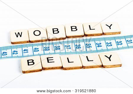 Health Concept Of A Tape Measure Also Showing The Message Wobbly Belly