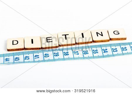 Health Concept Of A Tape Measure Also Showing The Message Dieting