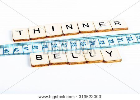 Health Concept Of A Tape Measure Also Showing The Message Thinner Belly