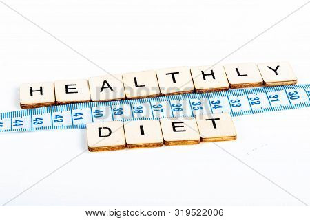 Health Concept Of A Tape Measure Also Showing The Message Healthy Diet