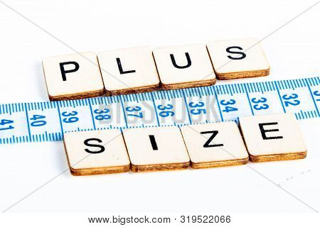 Health Concept Of A Tape Measure Also Showing The Message Plus Size