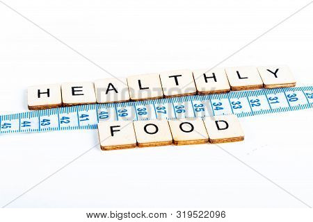 Health Concept Of A Tape Measure Also Showing The Message Healthy Food