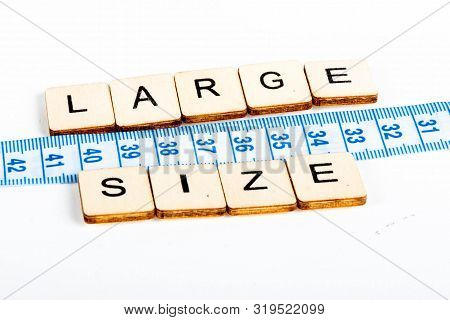 Health Concept Of A Tape Measure Also Showing The Message Large Size