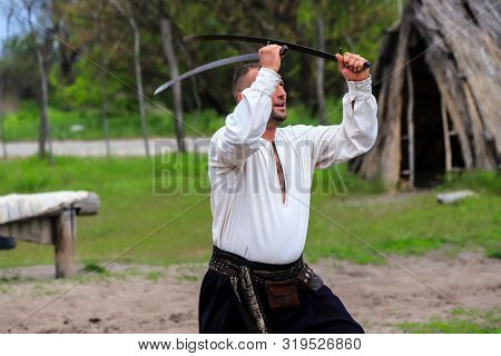 Petrikovka, Dnepropetrovsk Region, Ukraine, 28 04 2019. A Man Shows Exercises With Sabers At The Fes