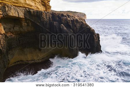 Huge Waves Crash On Cloudy Day. Kemmuna Island