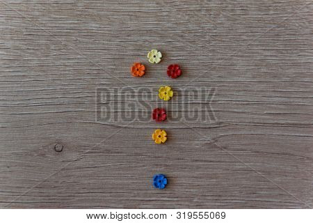 Question Sign From Plastic Colour Flowers Lego On The Wood Background. Concept For Confusion, Questi
