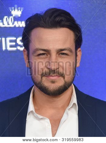 LOS ANGELES - JUL 26:  Tyler Hynes arrives for the Hallmark Channel and Hallmark Movies & Mysteries Summer 2019 TCA on July 26, 2019 in Los Angeles, CA                