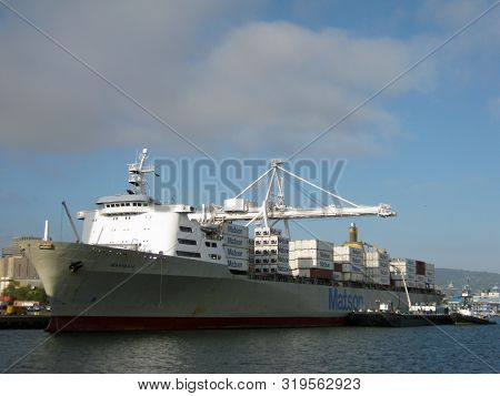 Oakland - August 4, 2011:  Matson Cargo Ship Mahi Mahi Loaded With Goods At Port By Cranes In Oaklan