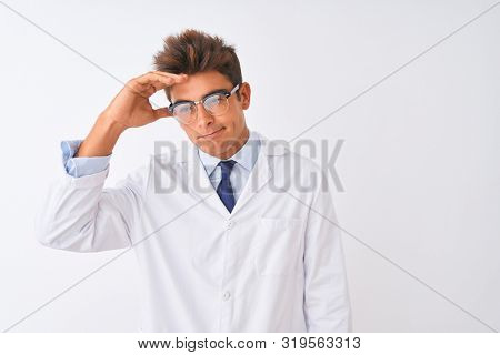 Young handsome sciencist man wearing glasses and coat over isolated white background worried and stressed about a problem with hand on forehead, nervous and anxious for crisis