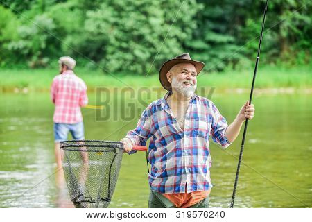 Activity And Hobby. Happy Cheerful People. Master Baiter. Fisherman With Fishing Rod. Fishing Freshw