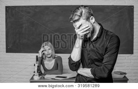 He Is So Shy. Male Student With Examiner At Examination. High School Student Saying Lesson. Handsome