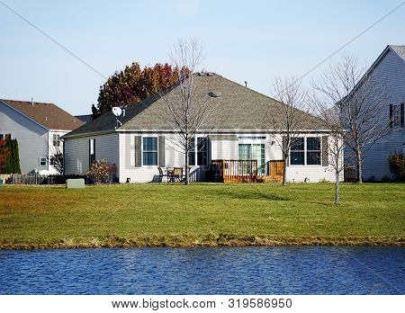 A Small Tract Home Next To A Small Lake In The Wesmere Country Club Subdivision Of Joliet, Illinois,