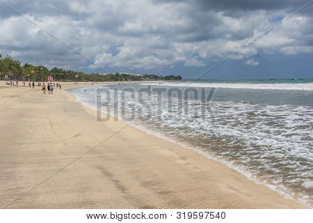 Kuta, Indonesia - October 20, 2018: People On The Beach Of Seminyak On Bali, Indonesia