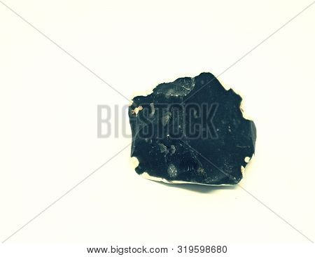 Chipped Obsidian Stone With Cavity Inside, Sharp Cracks Flint. Isolated Stone On White