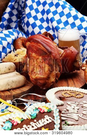 Traditional German Cuisine, Schweinshaxe Roasted Ham Hock. Beer, Pretzels And Various Bavarian Speci