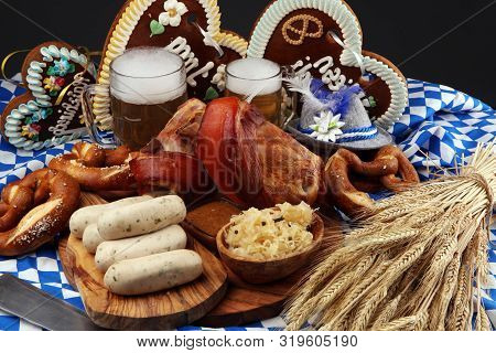 Traditional German Cuisine, Schweinshaxe Roasted Ham Hock. Beer, Pretzels And Various Bavarian Speci