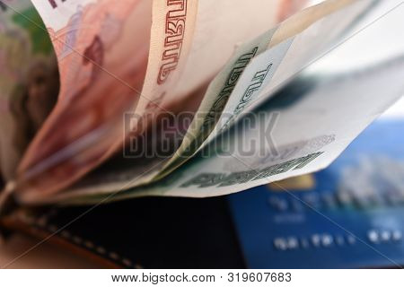 Russian Currency And Credit Card In The Wallet Close-up. Rubles. Russian Big Money. The Value Of Cur
