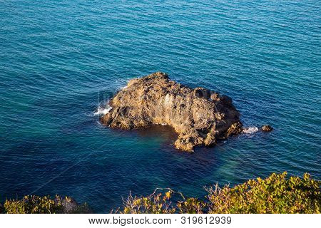 Exotic Rock In The Middle Of The Blue Sea
