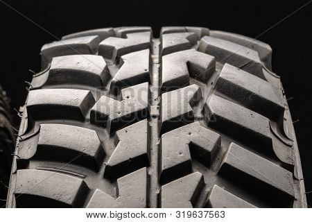 Off-road Tire Protector From Suv Class On A Black Background, Close-up.